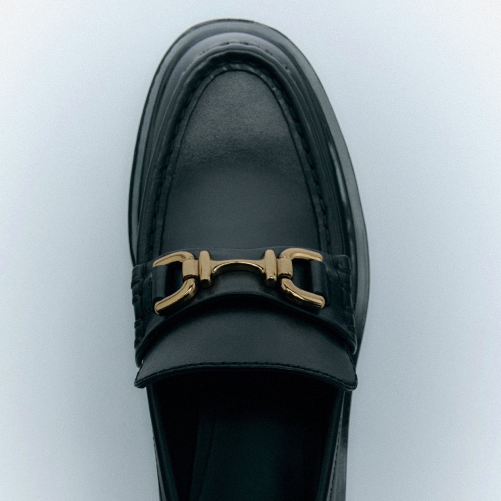 Lug Sole Black Leather Loafers with gold metal detail